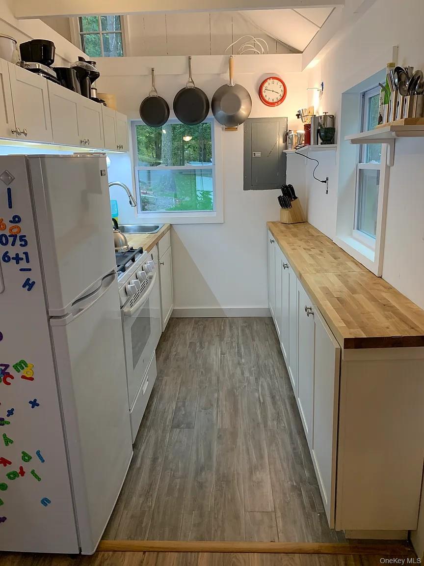 206 Sunset Cove Road Newburgh, NY 12550 - Photo 10 of 23 a kitchen with refrigerator and wooden floor