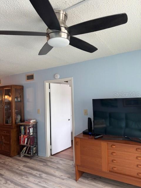 4746 Azalea Drive, Unit 103C New Port Richey, FL 34652 - Photo 11 of 68 a living room with furniture and a flat screen tv