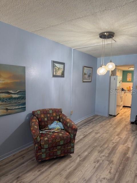 4746 Azalea Drive, Unit 103C New Port Richey, FL 34652 - Photo 11 of 35 a living room with furniture and a flat screen tv