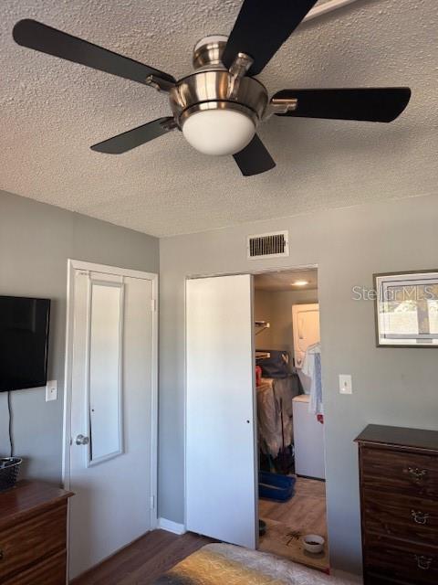 4746 Azalea Drive, Unit 103C New Port Richey, FL 34652 - Photo 14 of 35 a bedroom with a bed and wooden floor
