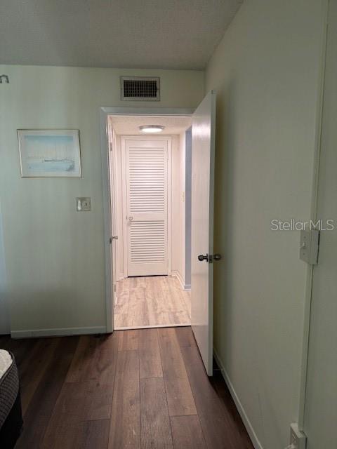 4746 Azalea Drive, Unit 103C New Port Richey, FL 34652 - Photo 19 of 68 a view of an empty room with wooden floor and a window
