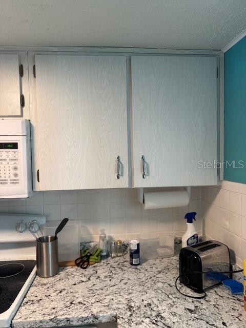 4746 Azalea Drive, Unit 103C New Port Richey, FL 34652 - Photo 19 of 35 a kitchen with a sink and cabinets