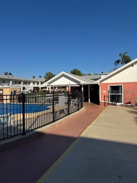 4746 Azalea Drive, Unit 103C New Port Richey, FL 34652 - Photo 27 of 35 a view of a house with backyard and sitting area