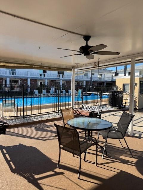 4746 Azalea Drive, Unit 103C New Port Richey, FL 34652 - Photo 29 of 35 a view of a patio with a table and chairs