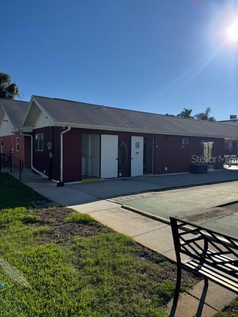 4746 Azalea Drive, Unit 103C New Port Richey, FL 34652 - Photo 31 of 35 a house view with a garden space