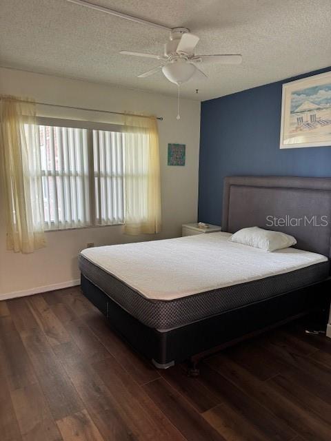 4746 Azalea Drive, Unit 103C New Port Richey, FL 34652 - Photo 32 of 68 a bedroom with a bed and window
