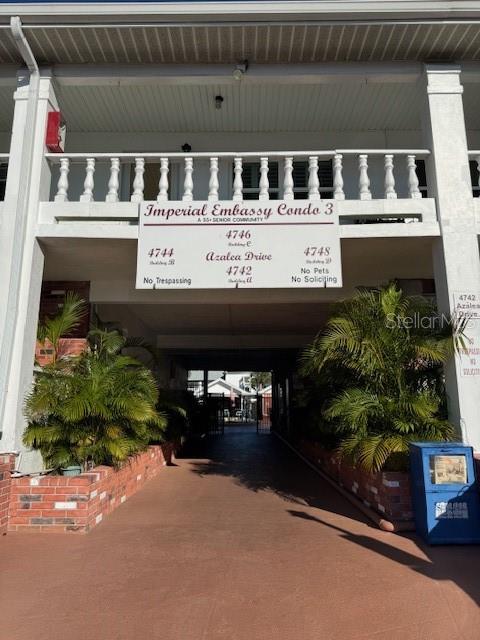 4746 Azalea Drive, Unit 103C New Port Richey, FL 34652 - Photo 33 of 35 a view of a street with potted plants