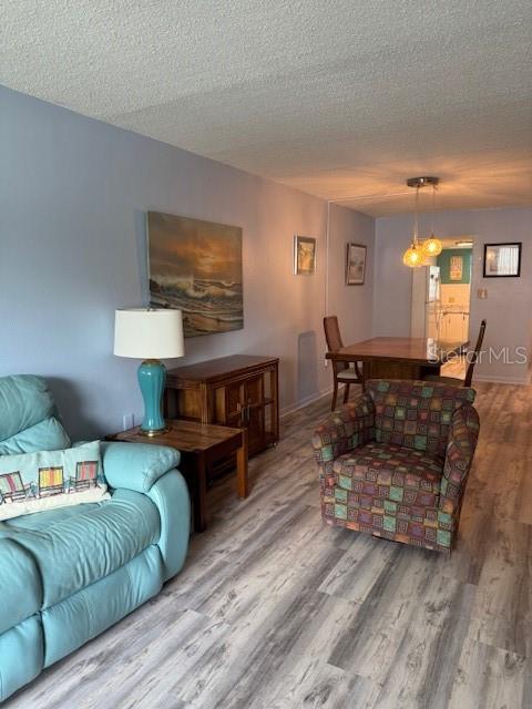 4746 Azalea Drive, Unit 103C New Port Richey, FL 34652 - Photo 6 of 68 a living room with furniture and a wooden floor