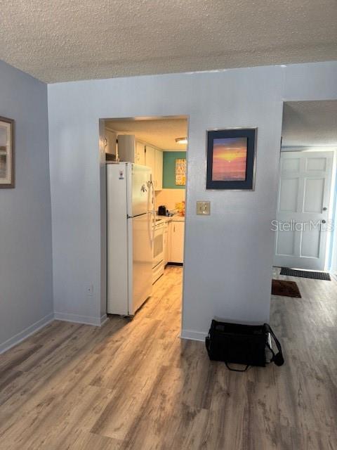 4746 Azalea Drive, Unit 103C New Port Richey, FL 34652 - Photo 8 of 35 a room with a bed and a dresser