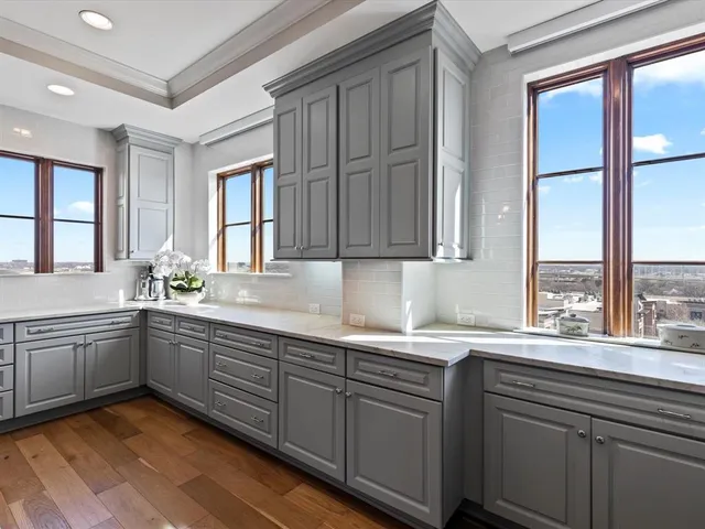 a bed room with a bed and a large window