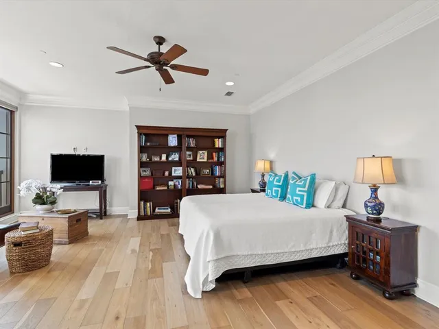 a bed room with bed and a chair