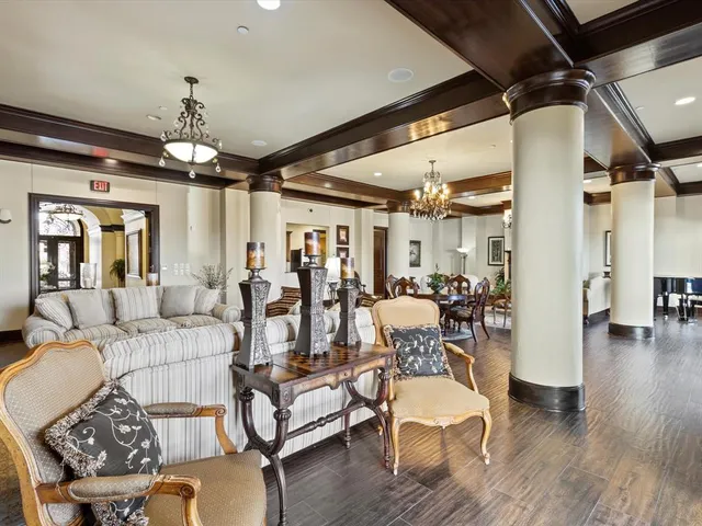a view of a dining room with furniture wooden floor and chandelier