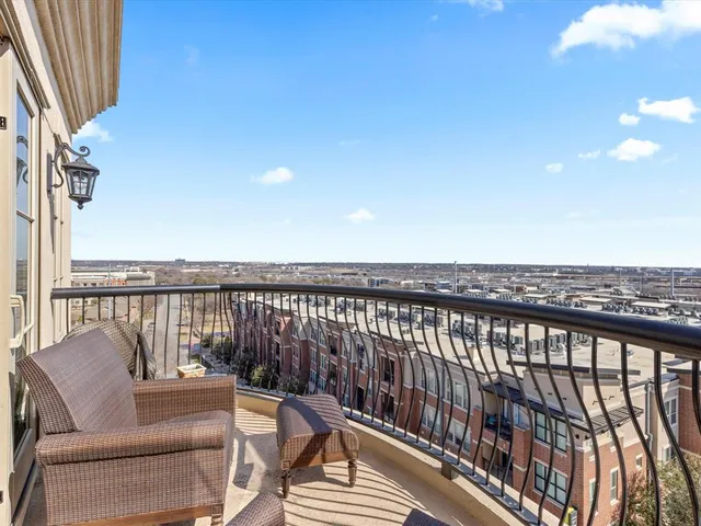 a balcony with chairs