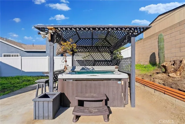 a view of a patio with wooden floor and ocean view