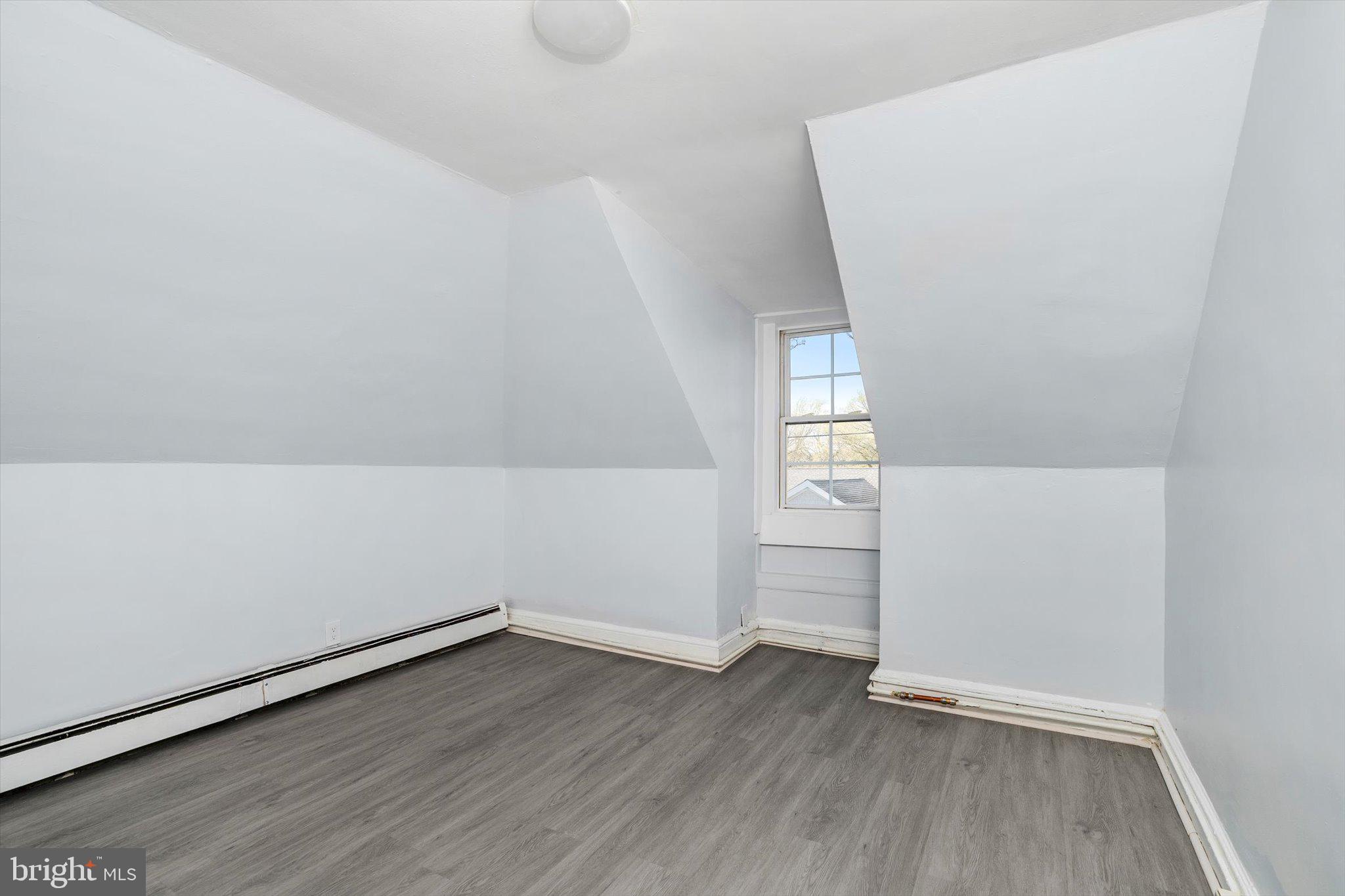 10 Lytle Street, Unit 5 Princeton, NJ 08542 - Photo 6 of 20 wooden floor in an empty room with a window