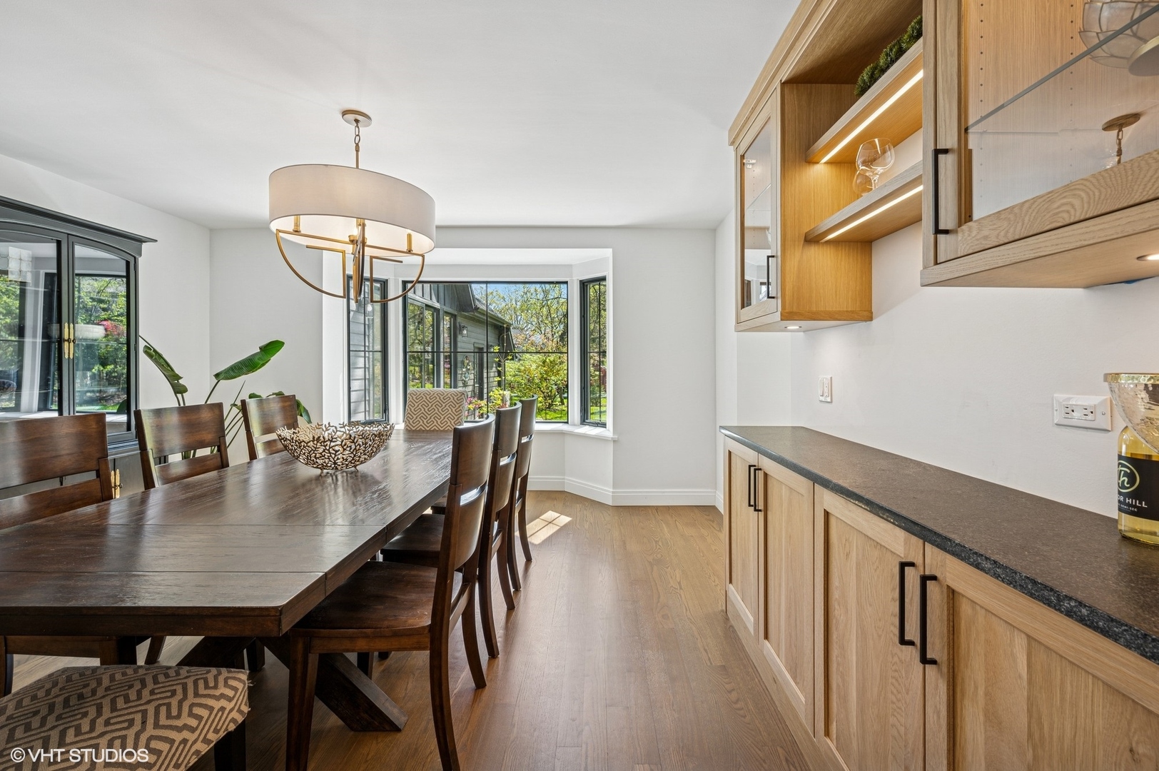 1933 Ridgewood Lane West Glenview, IL 60025 - Photo 16 of 42 a view of a dining room with furniture window and wooden floor