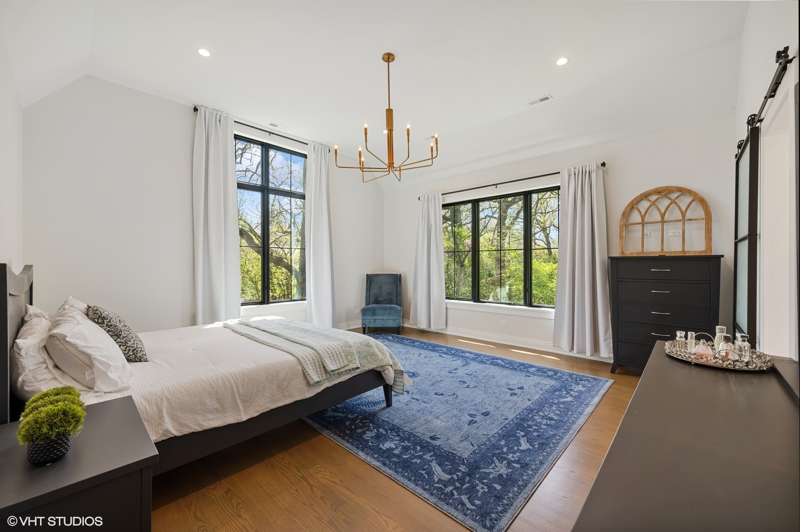 1933 Ridgewood Lane West Glenview, IL 60025 - Photo 21 of 42 a bedroom with a bed flat screen tv and windows