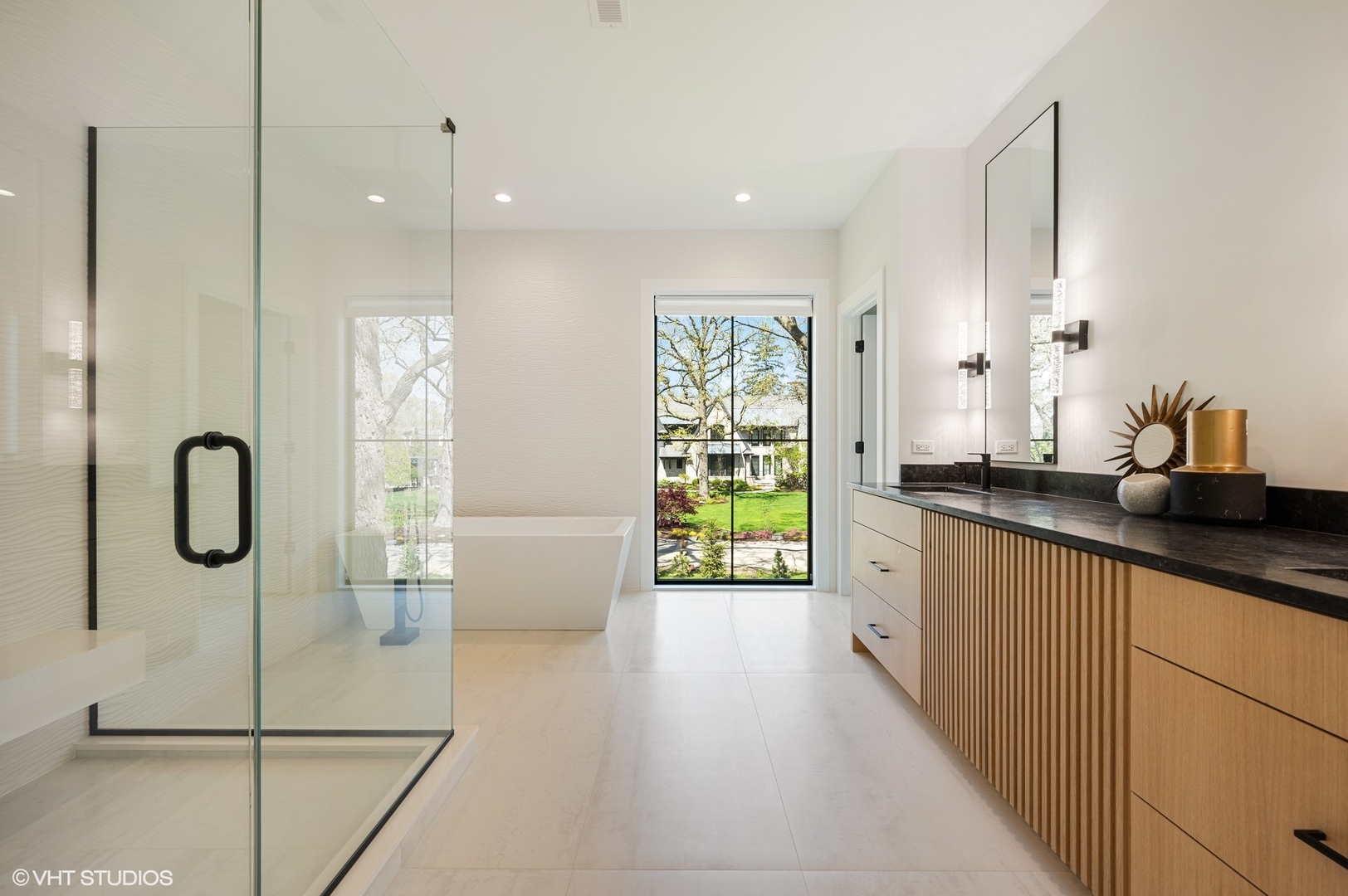 1933 Ridgewood Lane West Glenview, IL 60025 - Photo 22 of 42 a bathroom with a double vanity sink and a bathtub
