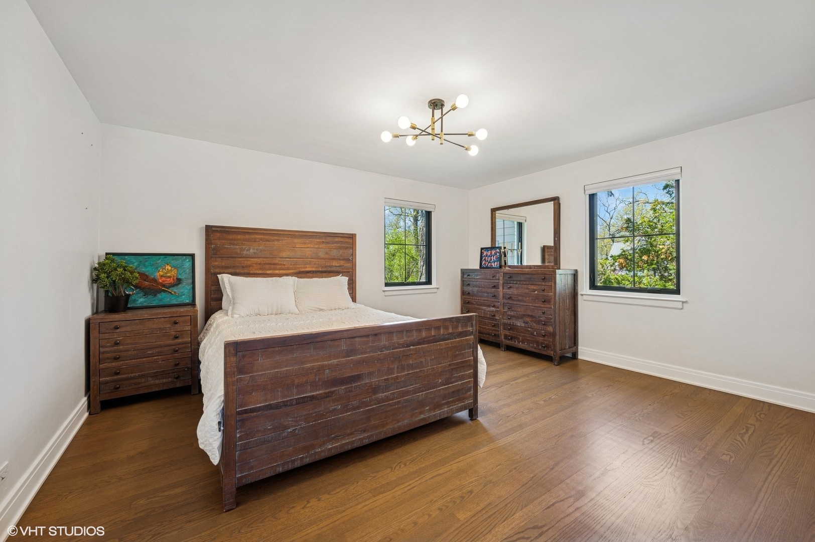 1933 Ridgewood Lane West Glenview, IL 60025 - Photo 25 of 42 a bedroom with a bed and a chandelier