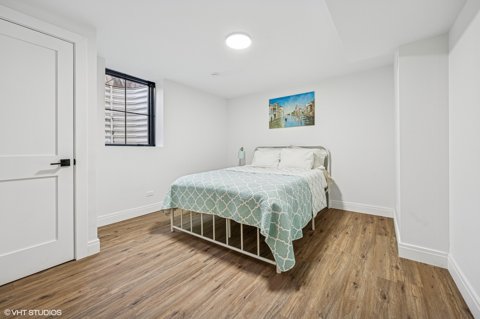 1933 Ridgewood Lane West Glenview, IL 60025 - Photo 28 of 42 a bedroom with a bed and wooden floor