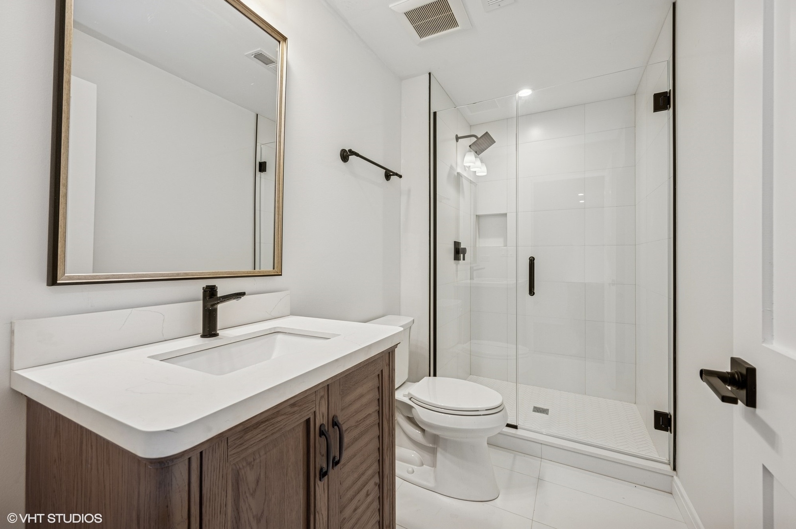 1933 Ridgewood Lane West Glenview, IL 60025 - Photo 29 of 42 a bathroom with a sink a toilet and shower