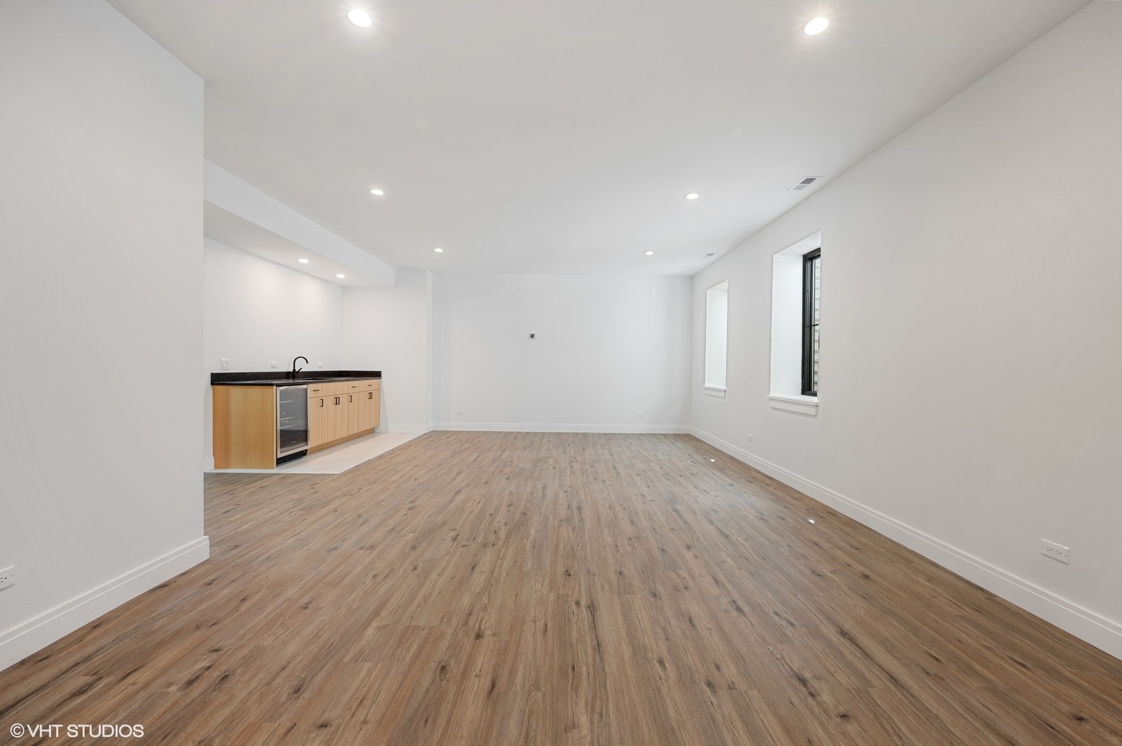 1933 Ridgewood Lane West Glenview, IL 60025 - Photo 33 of 42 a view of empty room with wooden floor and fan