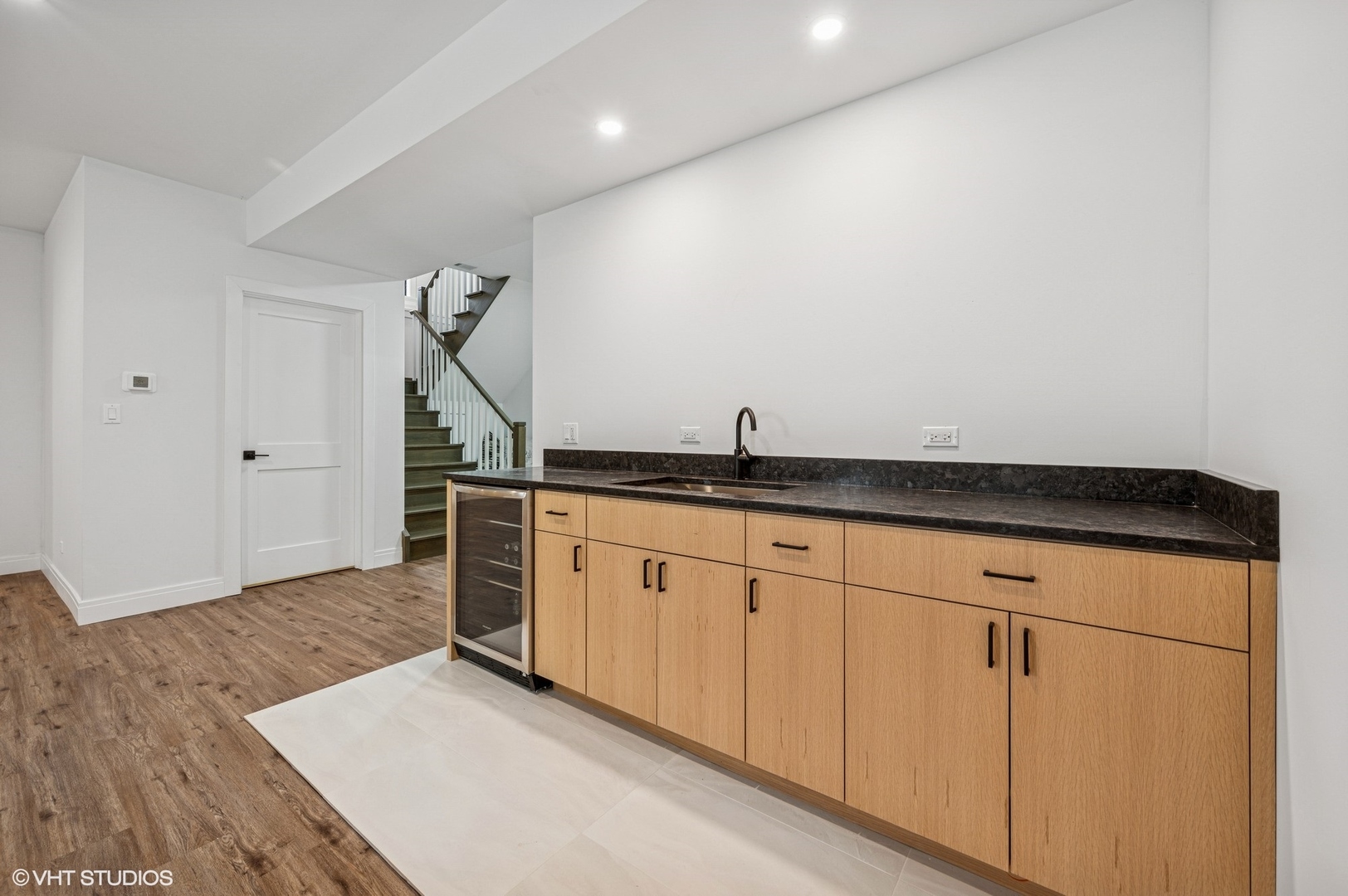 1933 Ridgewood Lane West Glenview, IL 60025 - Photo 34 of 42 a kitchen with granite countertop white cabinets and a sink