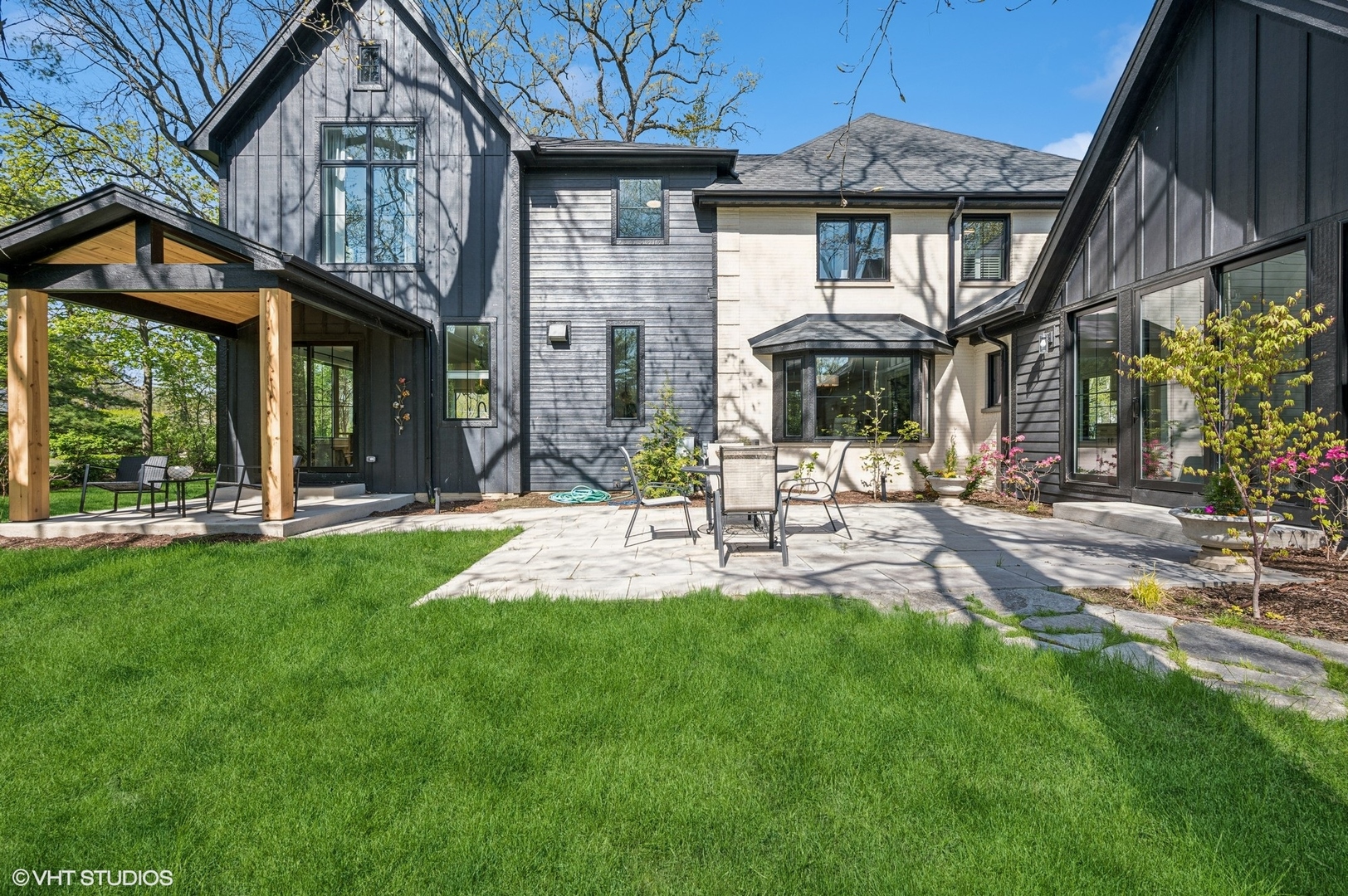 1933 Ridgewood Lane West Glenview, IL 60025 - Photo 36 of 42 a view of a house with a yard porch and sitting area