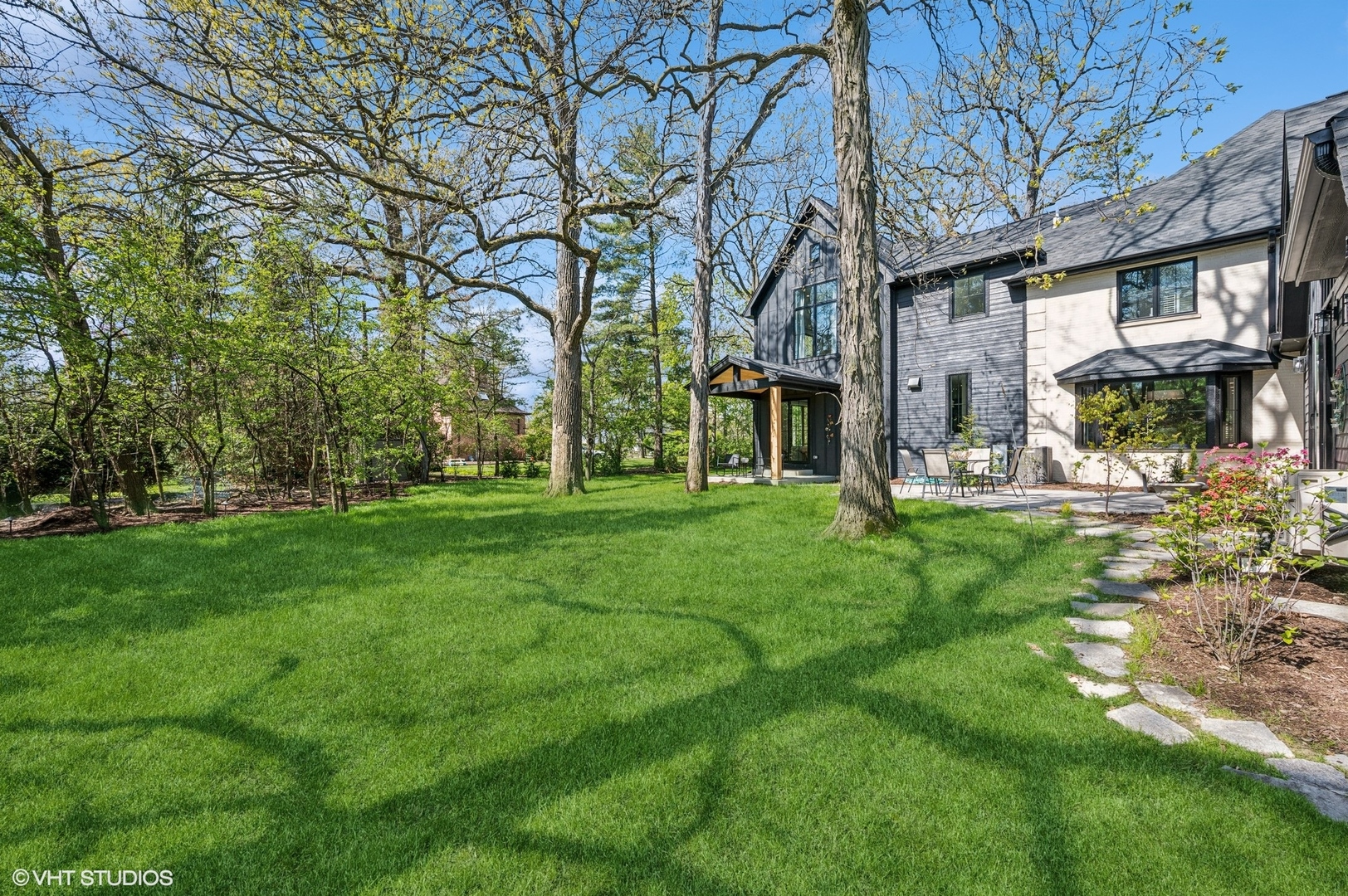1933 Ridgewood Lane West Glenview, IL 60025 - Photo 38 of 42 a view of a brick house with a big yard and large tree