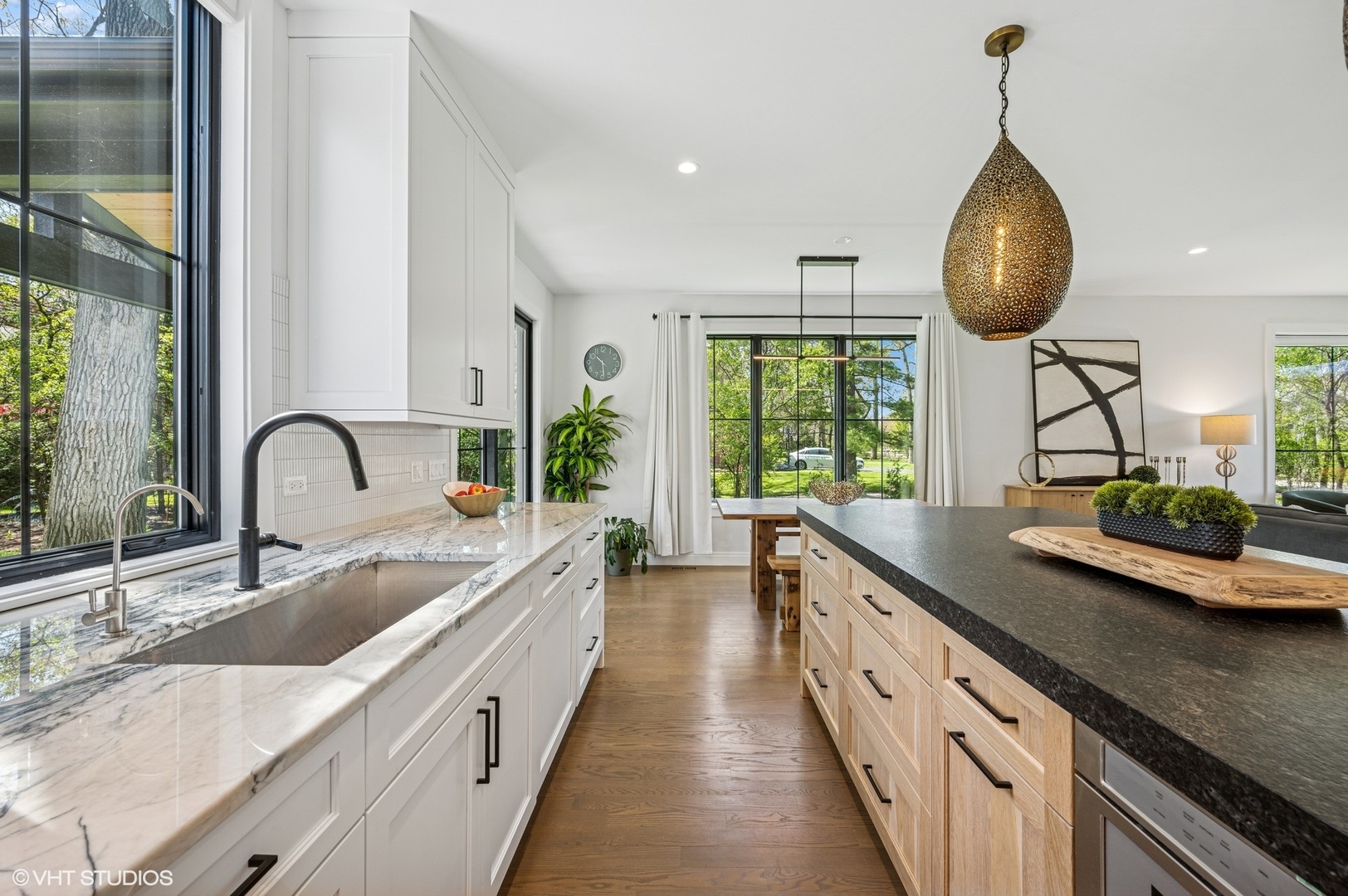 1933 Ridgewood Lane West Glenview, IL 60025 - Photo 6 of 42 a large kitchen with granite countertop a sink and a large window