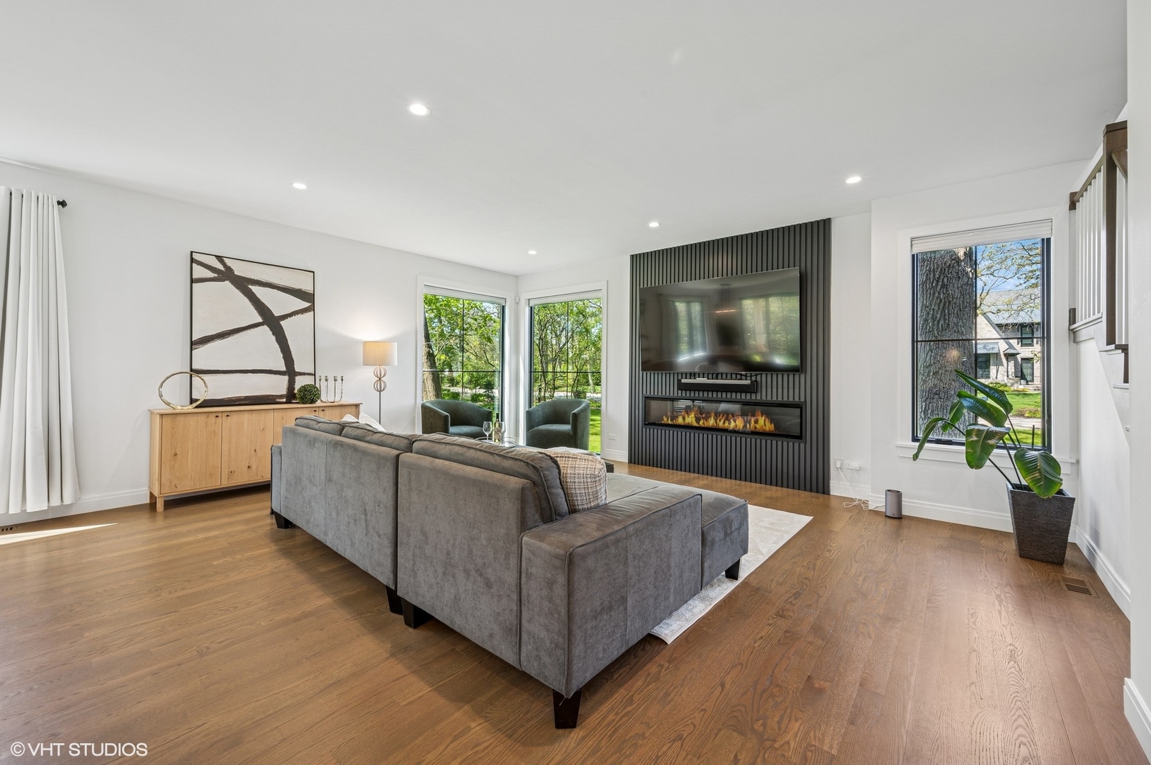 1933 Ridgewood Lane West Glenview, IL 60025 - Photo 10 of 42 a living room with furniture and a flat screen tv
