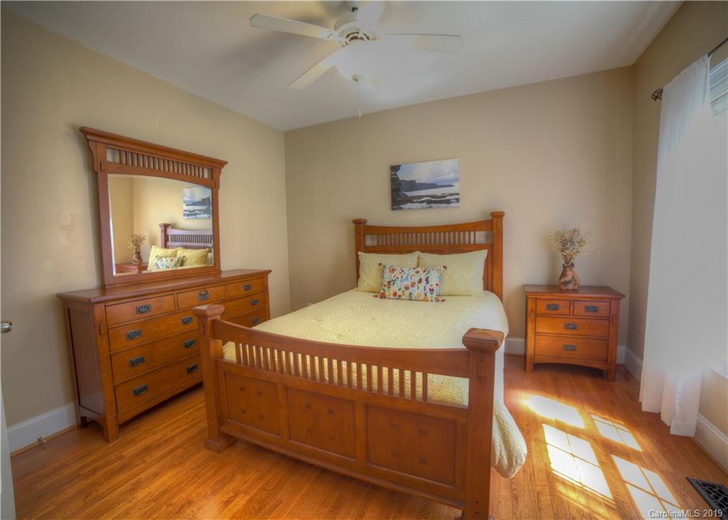 929 Ashford Way, Unit 79 Fort Mill, SC 29708 - Photo 15 of 39 a bedroom with a bed and a dresser