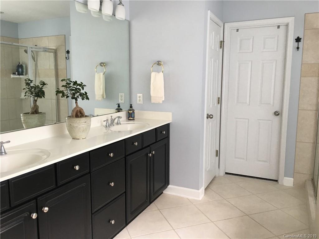 929 Ashford Way, Unit 79 Fort Mill, SC 29708 - Photo 20 of 39 a bathroom with a granite countertop sink and a mirror