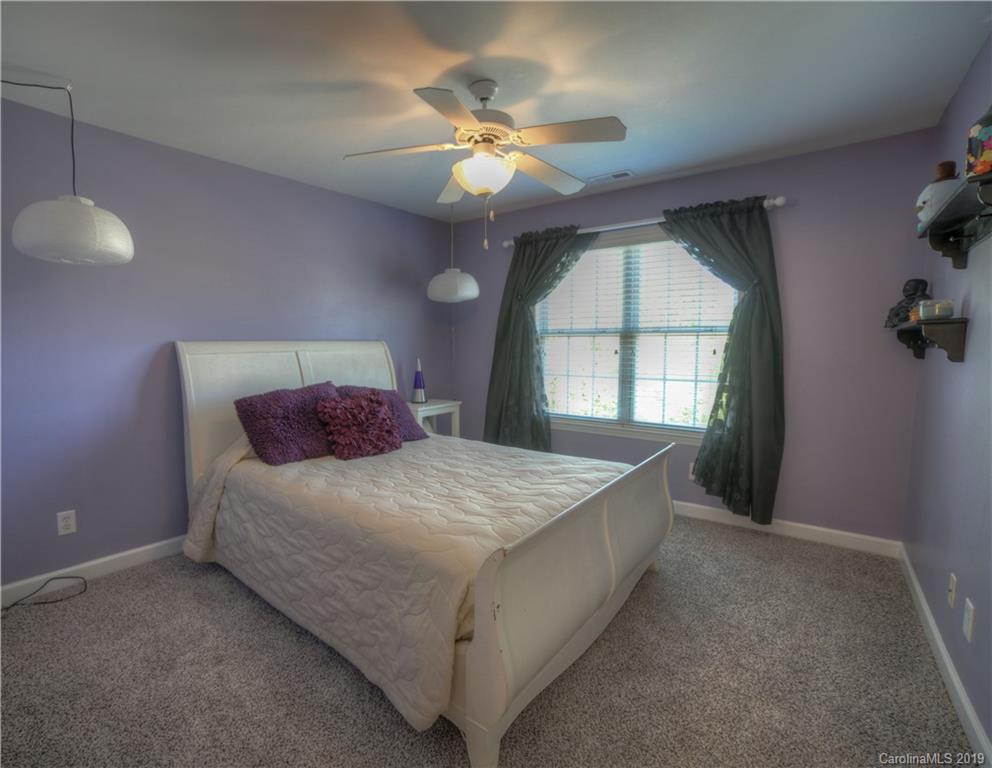 929 Ashford Way, Unit 79 Fort Mill, SC 29708 - Photo 23 of 39 a bedroom with a bed and a window