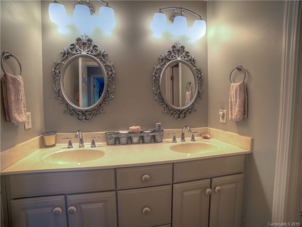 929 Ashford Way, Unit 79 Fort Mill, SC 29708 - Photo 24 of 39 a bathroom with double vanity sinks and a mirror