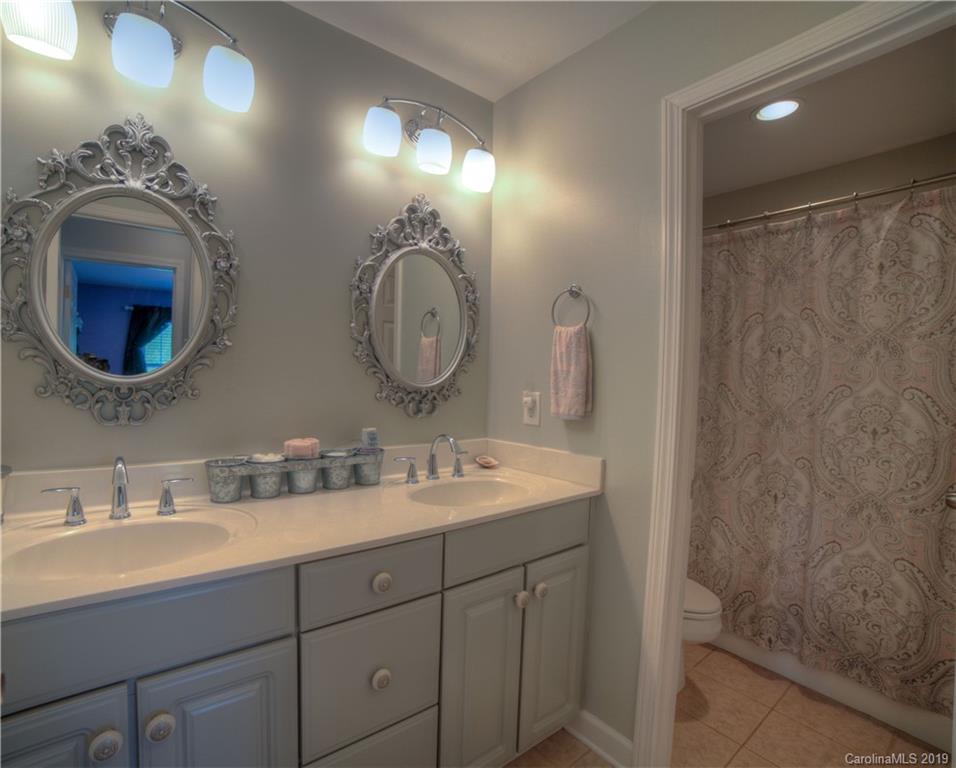 929 Ashford Way, Unit 79 Fort Mill, SC 29708 - Photo 25 of 39 a bathroom with a double vanity sink and a mirror