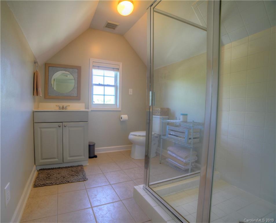 929 Ashford Way, Unit 79 Fort Mill, SC 29708 - Photo 27 of 39 a bathroom with a toilet sink and mirror