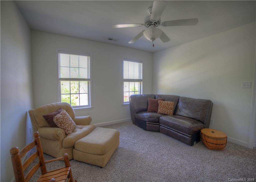 929 Ashford Way, Unit 79 Fort Mill, SC 29708 - Photo 29 of 39 a living room with furniture and a window