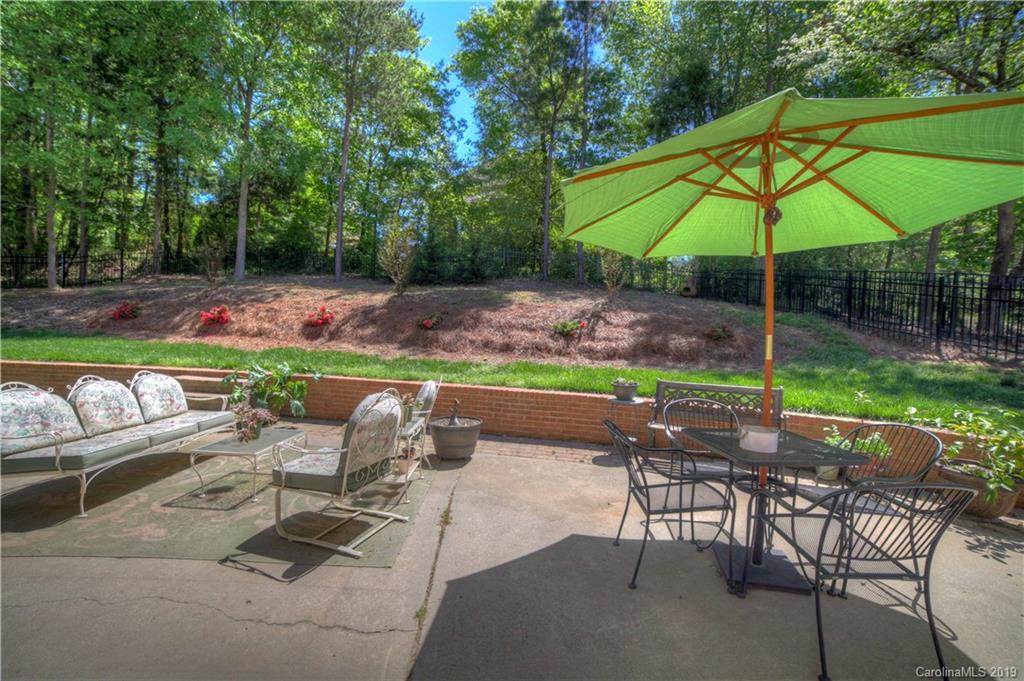 929 Ashford Way, Unit 79 Fort Mill, SC 29708 - Photo 30 of 39 a patio with a yard table and chairs
