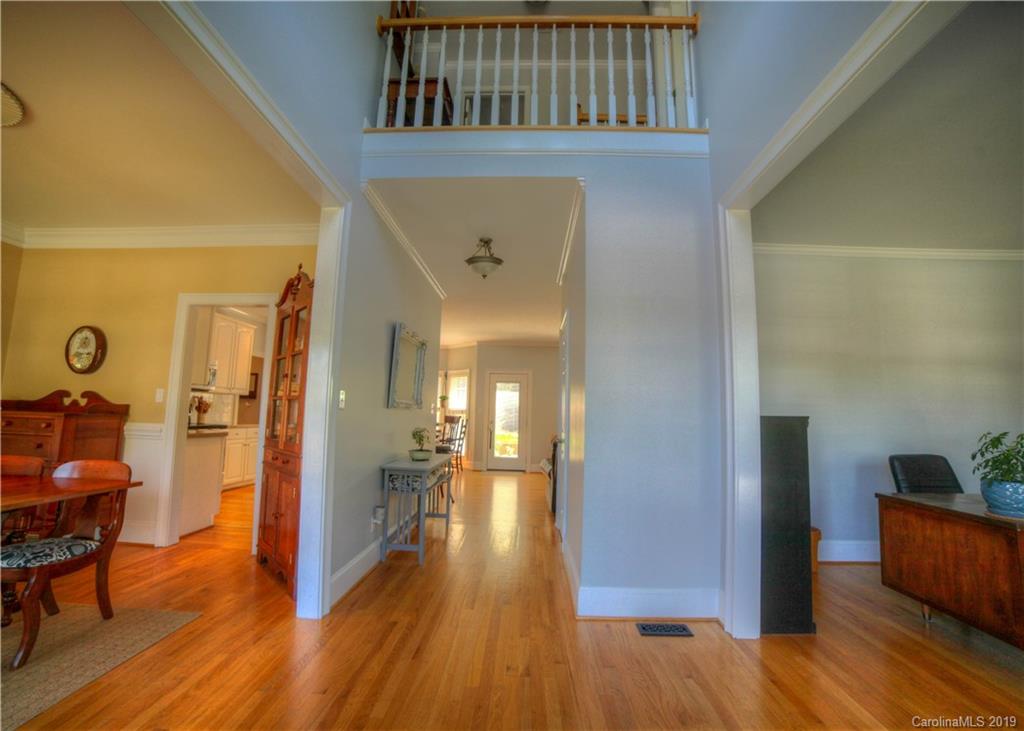 929 Ashford Way, Unit 79 Fort Mill, SC 29708 - Photo 4 of 39 a view of a hallway view with wooden floor and furniture