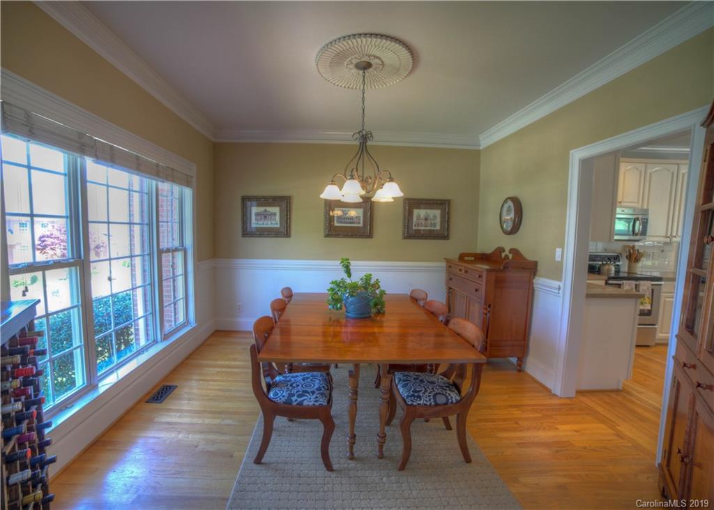 929 Ashford Way, Unit 79 Fort Mill, SC 29708 - Photo 5 of 39 a view of a dining room with furniture window and wooden floor