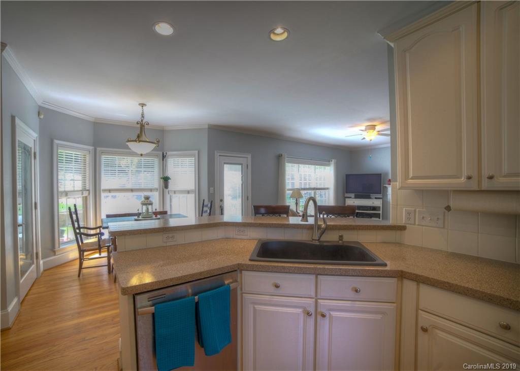 929 Ashford Way, Unit 79 Fort Mill, SC 29708 - Photo 8 of 39 a kitchen with a sink a counter space appliances and cabinets