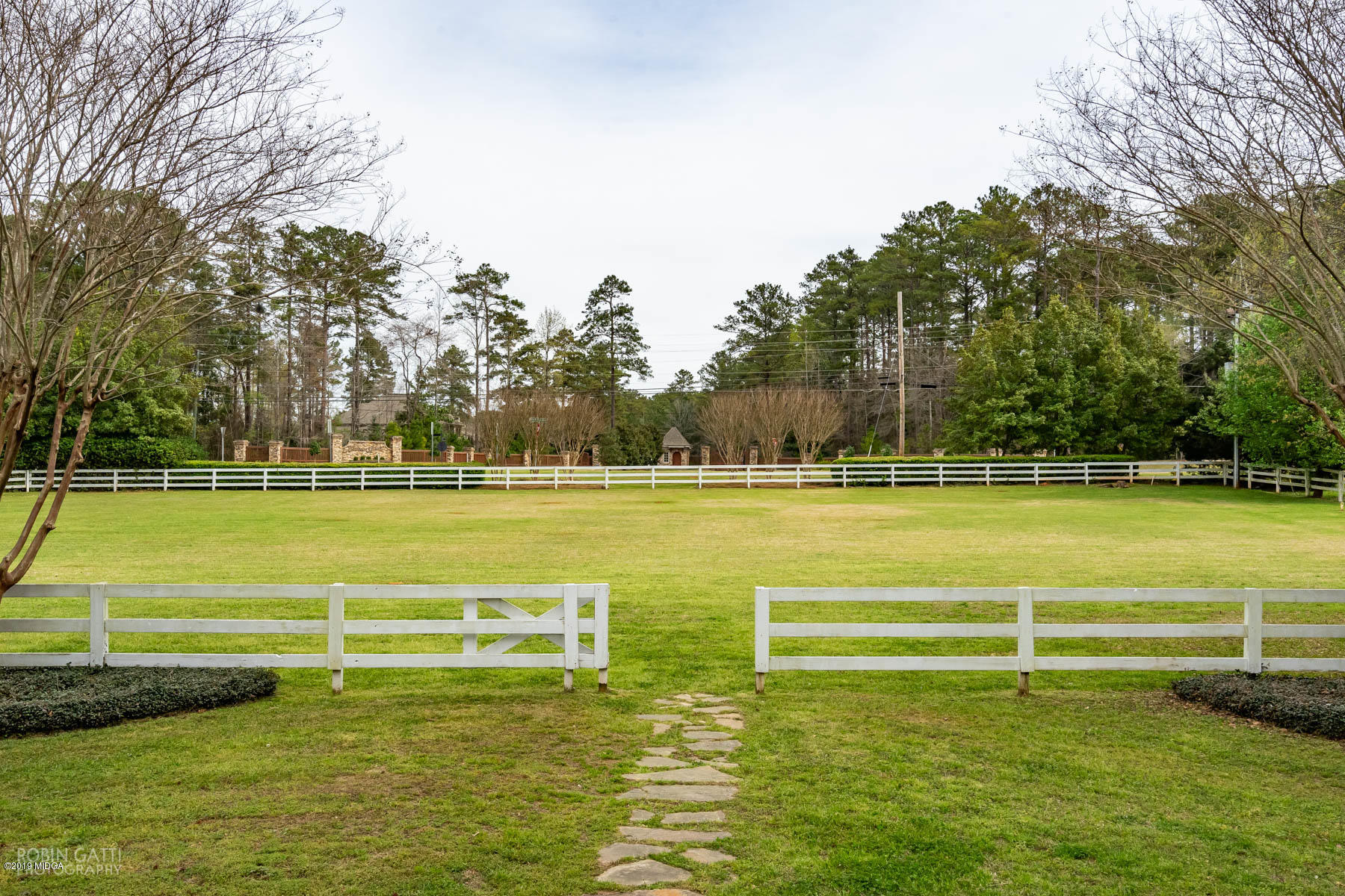 6150 Old Forsyth Road Macon, GA 31210 - Photo 2 of 50 a view of a swimming pool with a yard