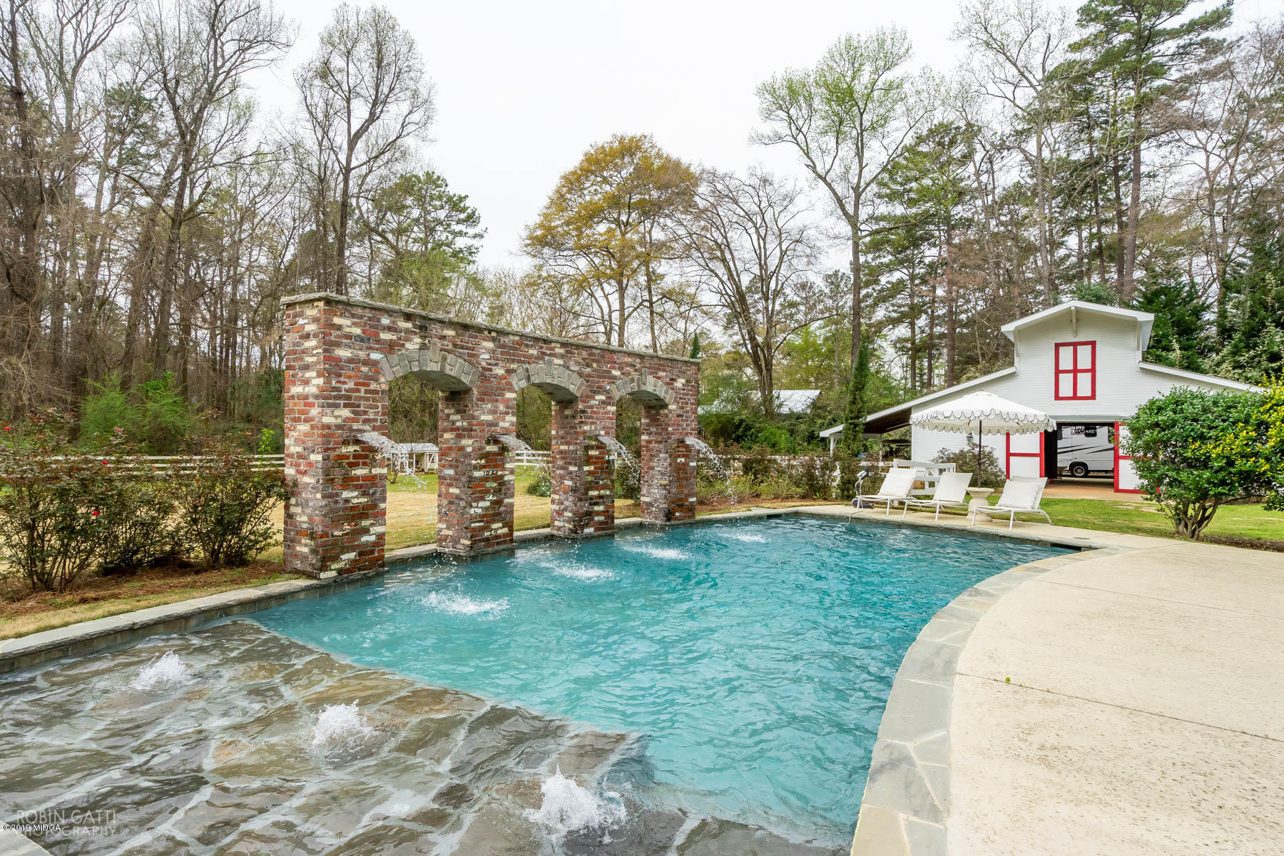 6150 Old Forsyth Road Macon, GA 31210 - Photo 17 of 50 a front view of a house with garden
