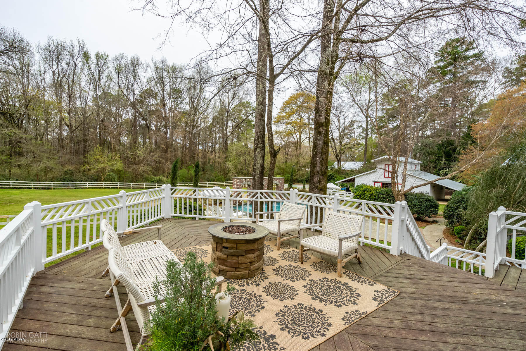 6150 Old Forsyth Road Macon, GA 31210 - Photo 25 of 50 a view of a chairs and table on the wooden deck