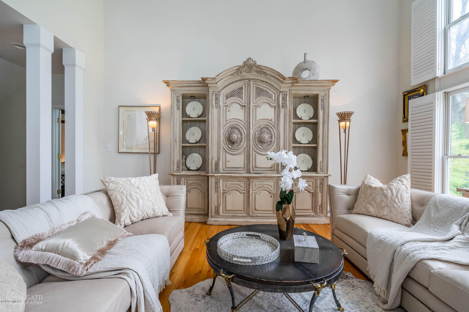 6150 Old Forsyth Road Macon, GA 31210 - Photo 29 of 50 a living room with furniture a clock and a large window