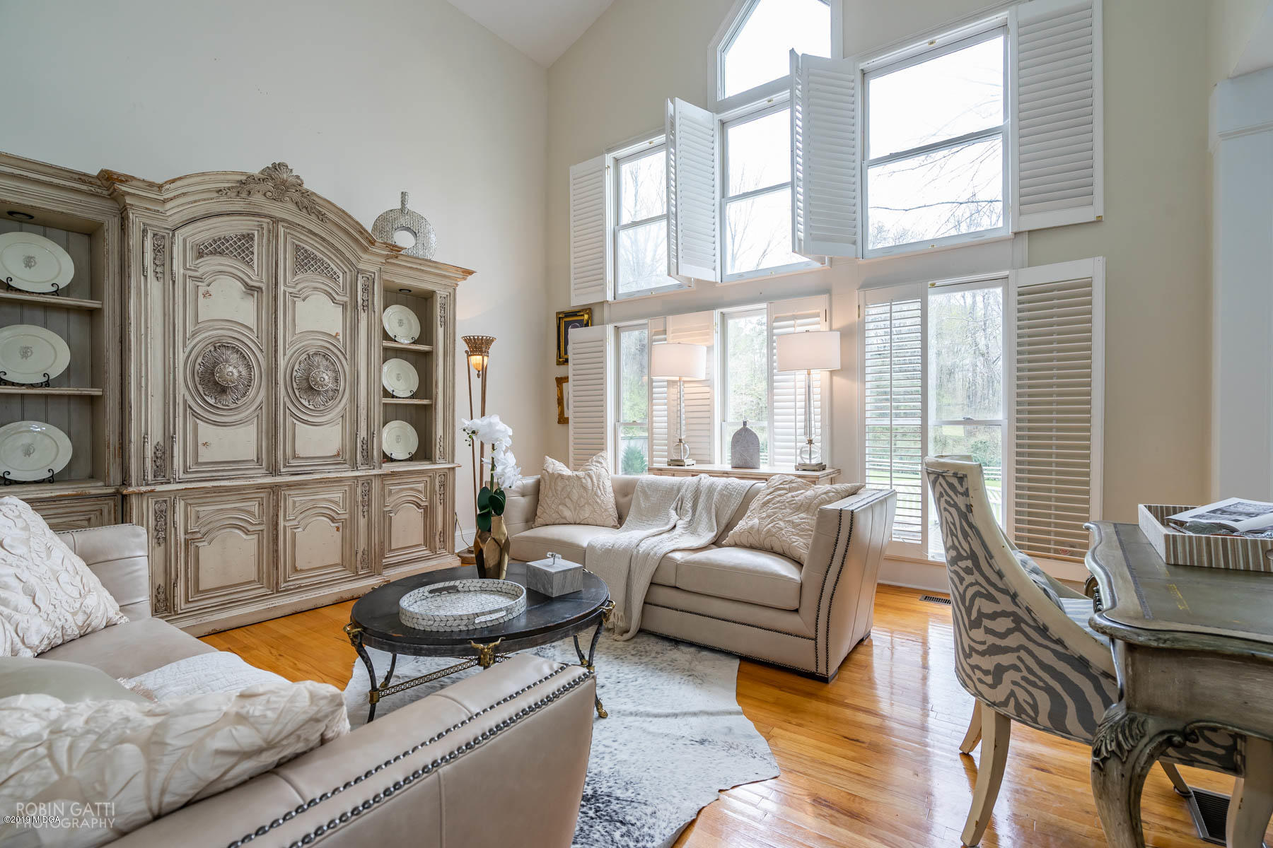 6150 Old Forsyth Road Macon, GA 31210 - Photo 30 of 50 a living room with furniture a flat screen tv and a large window