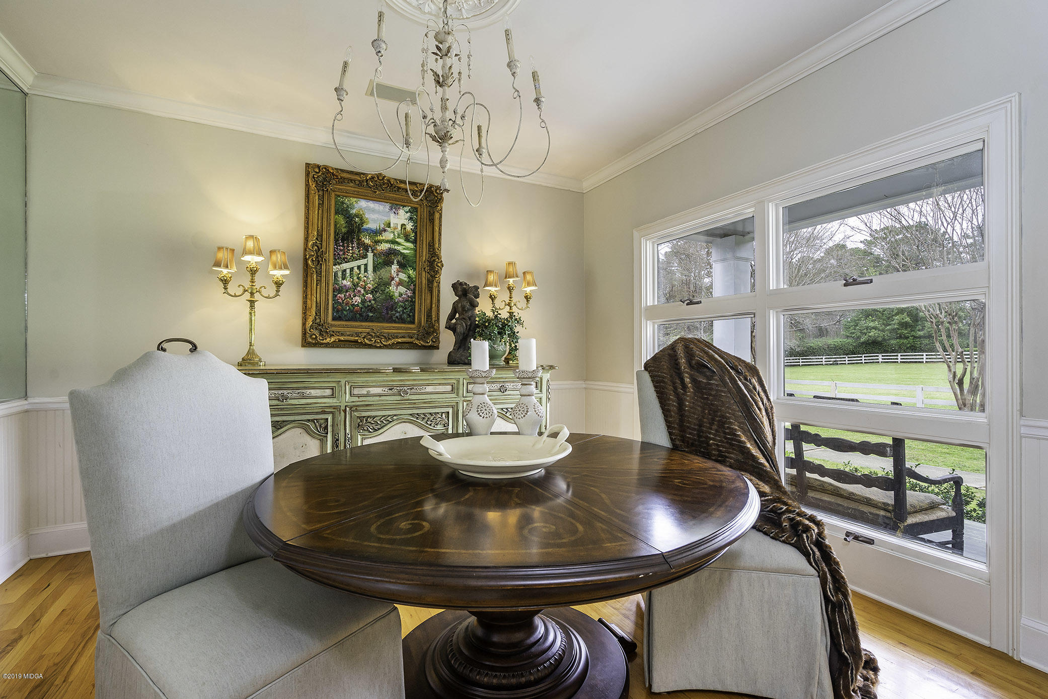 6150 Old Forsyth Road Macon, GA 31210 - Photo 39 of 50 a dining room with furniture a large window and a chandelier