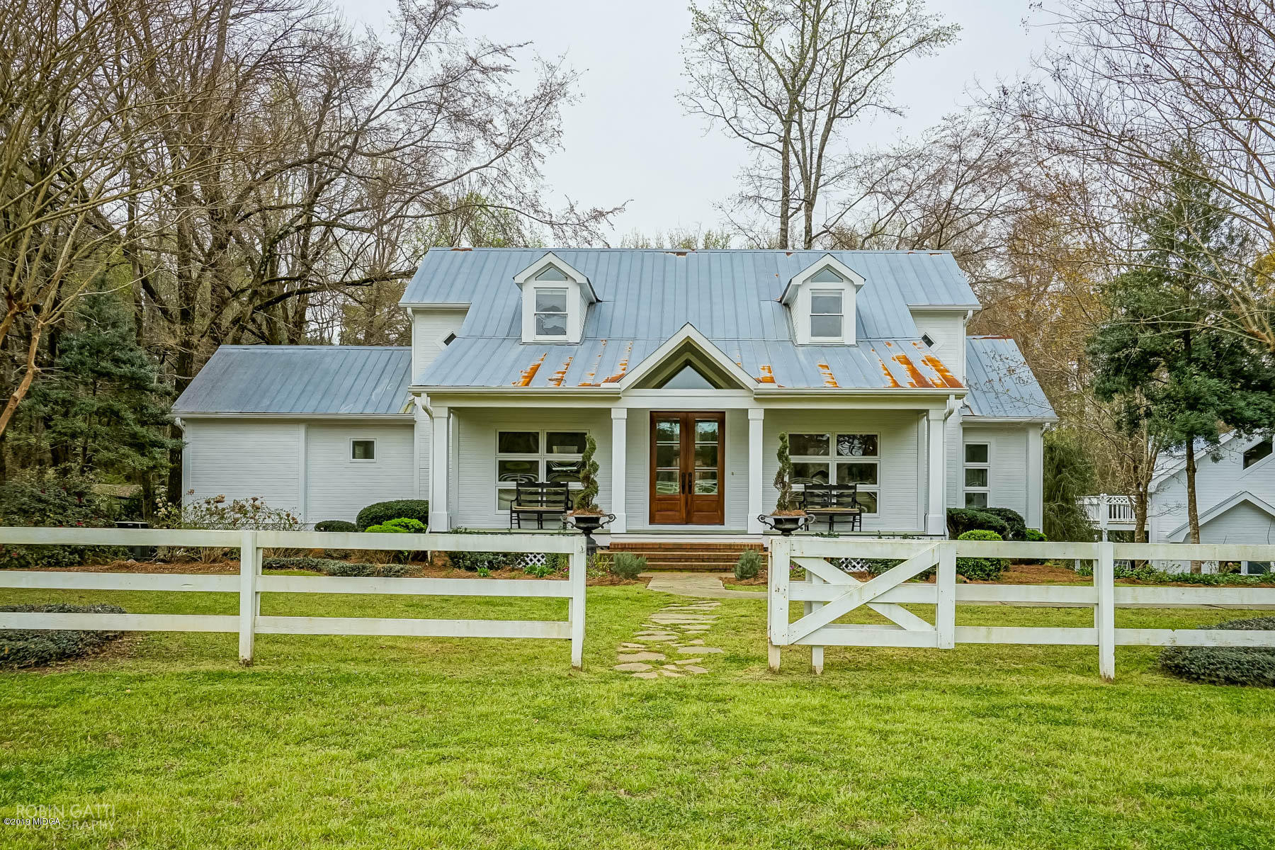 6150 Old Forsyth Road Macon, GA 31210 - Photo 6 of 50 a front view of a house with a yard
