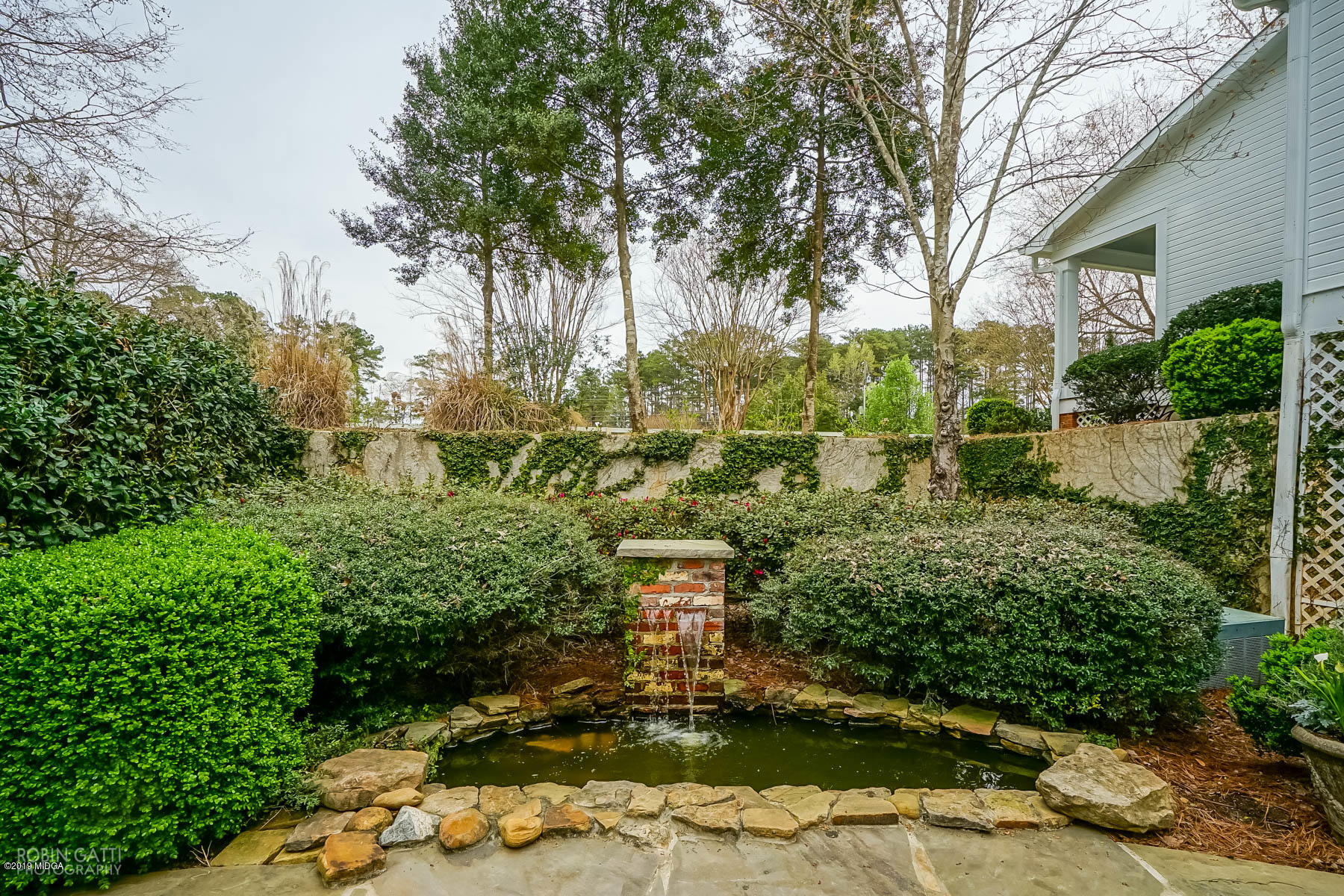 6150 Old Forsyth Road Macon, GA 31210 - Photo 10 of 50 a view of a garden with large trees